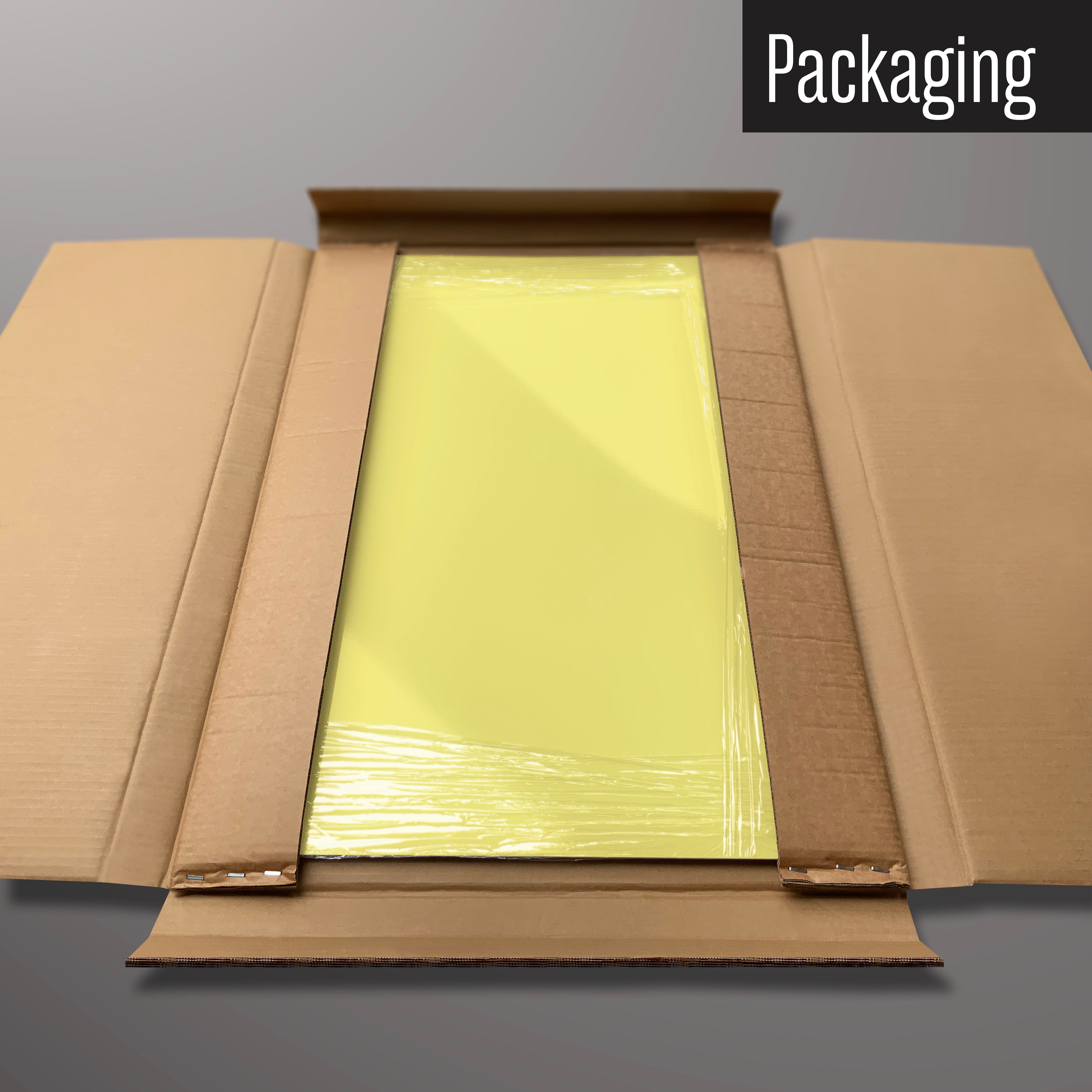 A plain yellow magnetic board in it’s cardboard packaging