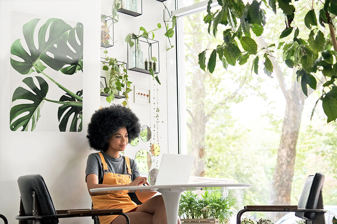 Monstera magnetic board in a plant-filled workspace