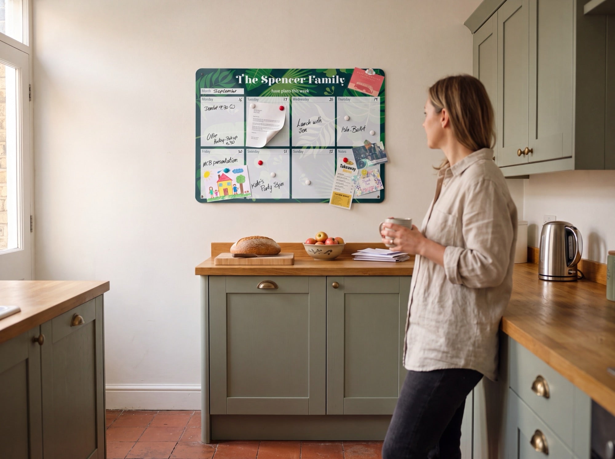 A personalised weekly planner on a kitchen wall
