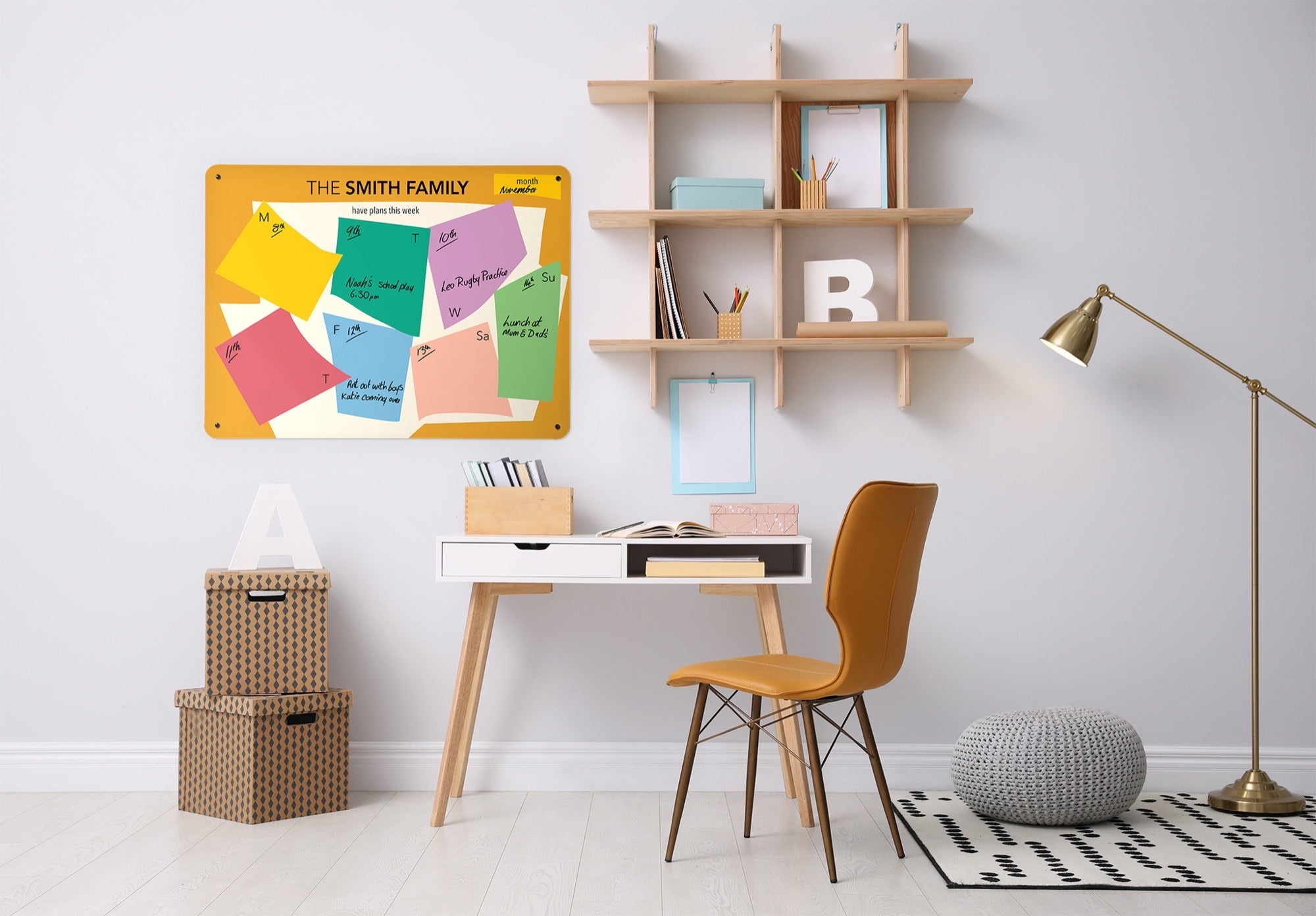 A Paper cut personalised weekly planner above a desk, the week filled in by hand
