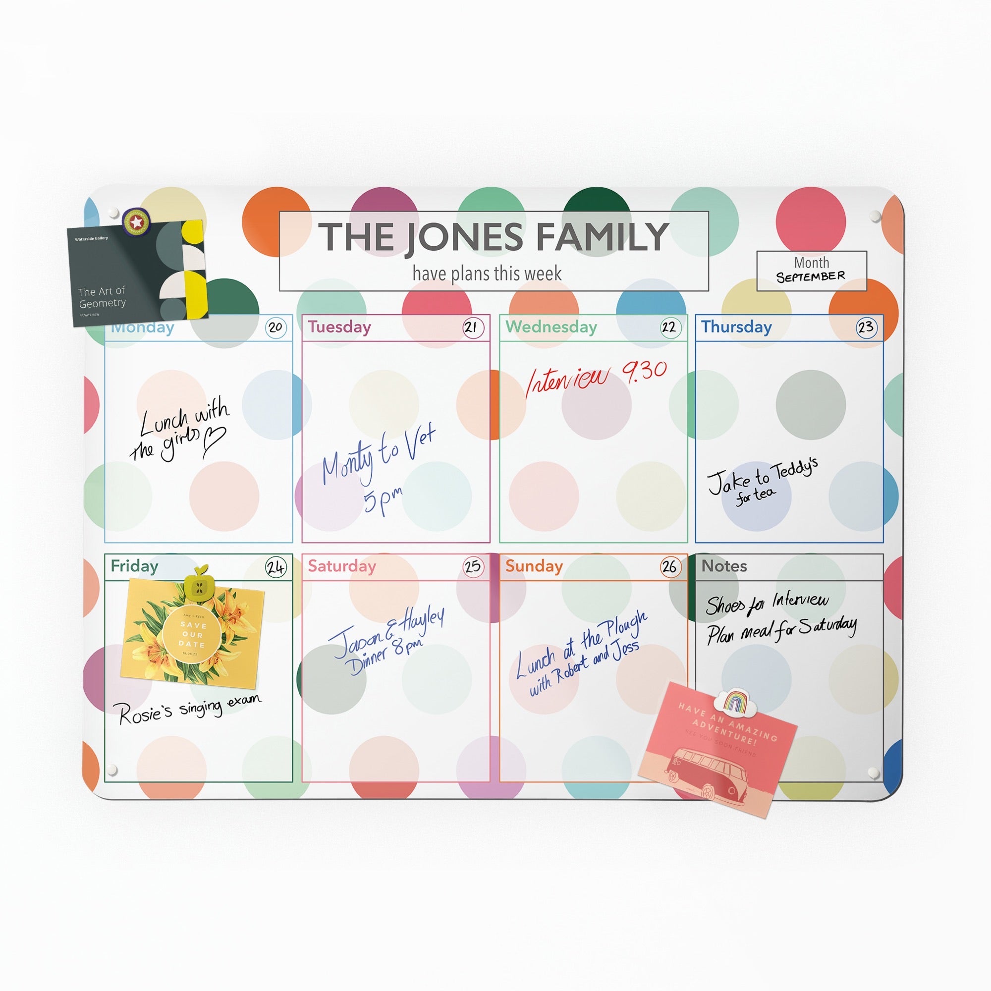 The Spots personalised weekly planner, filled in by hand with a postcard held on by a magnet