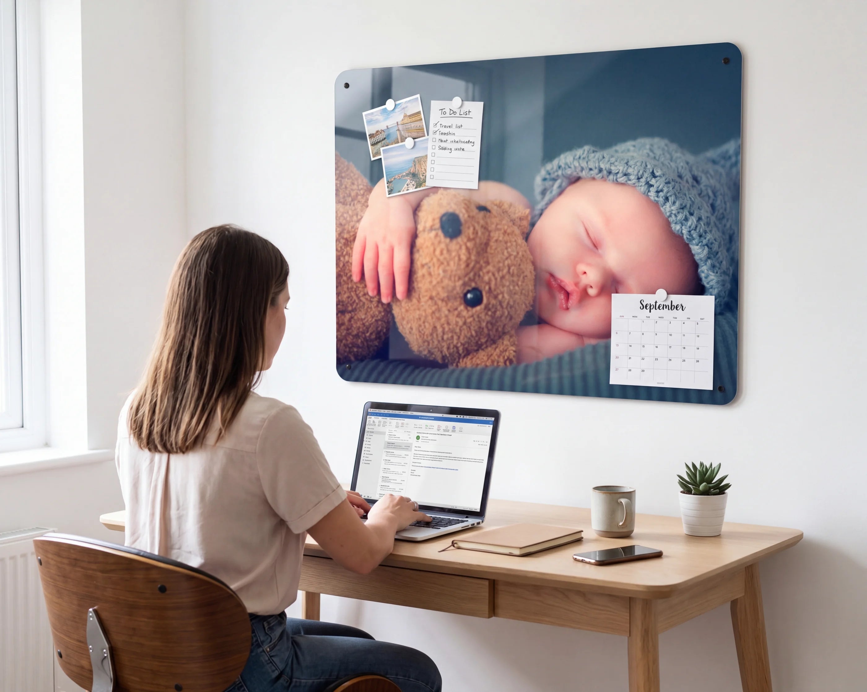 A personalised photo panel above a home desk