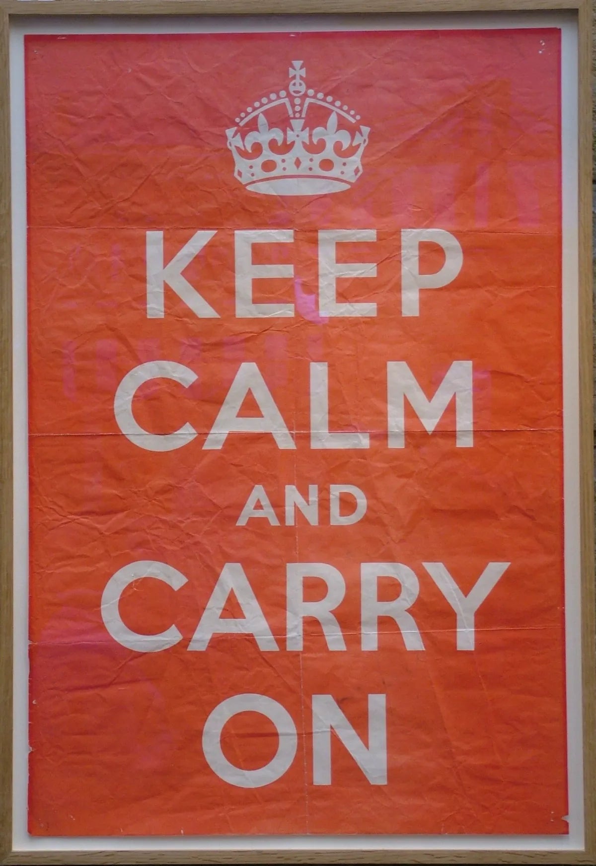 An original 1939 Keep Calm and Carry On poster, framed, at Barter Books in Alnwick